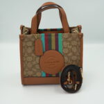 شنطة Coach Dempsey Tote   من القماش والجلد قاعدة 22  اللون البني High Quality