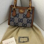 Gucci Diana mini tote bag with a GG canvas and bamboo handles