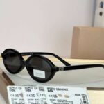Miu Miu MU 04ZS Regard oval-frame acetate sunglasses in black.