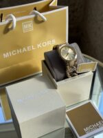 ⁦Michael Kors Lady Nini Three-Hand Gold-Tone Stainless Steel Women's Watch⁩ - الصورة ⁦4⁩