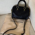 Louis Vuitton Speedy Bandoulière 20 is crafted from black Monogram
