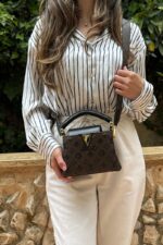 ⁦Louis Vuitton Capucines Mini handbag, featuring black Taurillon leather⁩ - الصورة ⁦2⁩