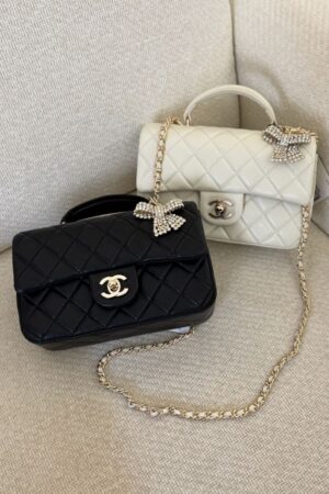 Chanel Mini Classic handbag with a top handle