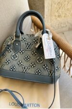 ⁦Louis Vuitton bag is the Alma BB crafted from denim monogram⁩ - الصورة ⁦2⁩