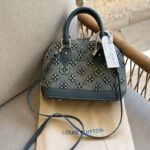 Louis Vuitton bag is the Alma BB crafted from denim monogram